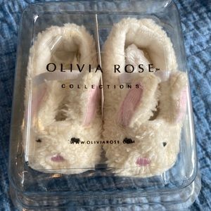 Brand new in packaging Olivia Rose bunny slippers. Size 0-6 months.